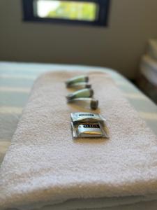 a close up of a towel on a bed at Golden Age Hotel in Beaufort +1 photo