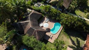 an overhead view of a resort with a swimming pool at Amélia Pousada de Charme in Porto De Galinhas