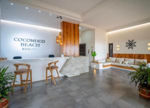 a lobby of a resort with a bar and a couch at Coconuco Beach Palomino in Palomino +93 photos