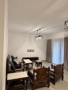 a living room with couches and tables at Celia new capital 3 bedrooms in Cairo +3 photos