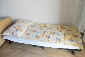 a bed with a pillow on top of it at Studio Nevidjane 8401a in Neviđane