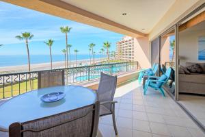a dining room with a view of the beach at Oceanfront Sunsets at Sonoran Spa E305 in Puerto Peñasco +37 photos
