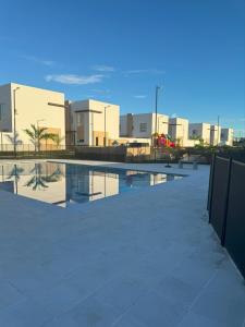 a pool of water in front of a building at Casa Yireth in Ricaurte