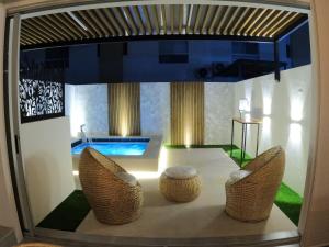 a view of a living room with a table and chairs at Casa Yireth in Ricaurte