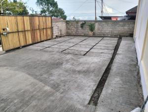 an empty patio with a wooden fence and a fence at Waceno Umma in Ruteng