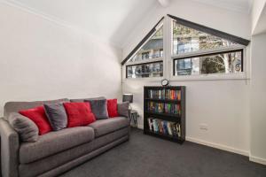 a living room with a couch and a window at Inala 2 in Thredbo