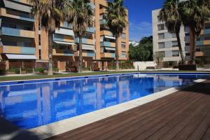 a swimming pool in front of a apartment building at Barcelona Olympic Apartment in Barcelona