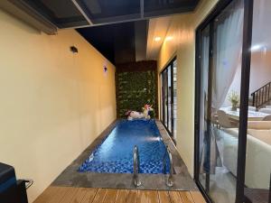 a swimming pool in a room with a bath tub at RV-Villa 4 bedrooms&Private Pool in Pulau Sembakau Kecil