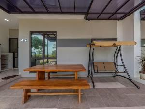 a room with a table and a bunk bed at RV-Villa 4 bedrooms&Private Pool in Pulau Sembakau Kecil