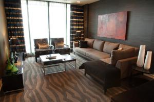 a living room with a couch and a table at Grand Papua Hotel in Port Moresby
