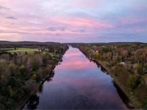 an aerial view of a river at sunset at Batiscan - Waterfront Private Spa & Sauna in Saint Adelphe