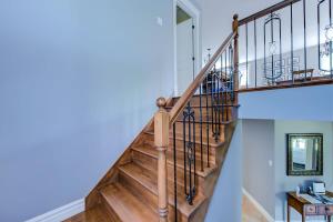 a staircase in a home with blue walls at L'Escapade - Spa billard & foyer in Petite-Rivière-Saint-François +62 photos