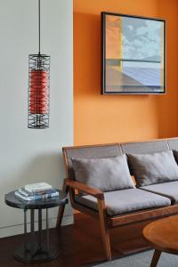 a living room with a couch and a table at Ananti at Busan Cove in Busan