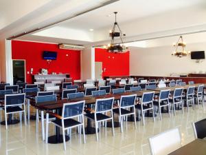 a large room with tables and chairs at Condado Hotel Casino Paso de la Patria in Paso de la Patria