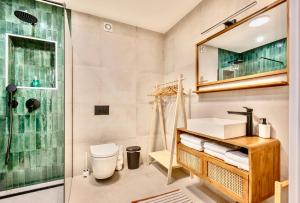 a bathroom with a shower and a toilet and a sink at Casa Verta in Skrad +42 photos