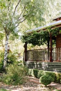 a porch of a house with a tree at The Brewers House in Beechworth