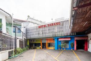 a parking lot in front of a hotel slaying at Rehat at Hotel Sabang in Bandung