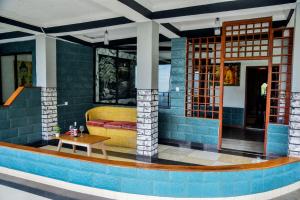 a living room with a couch and a table at Ella Mount Heaven in Ella