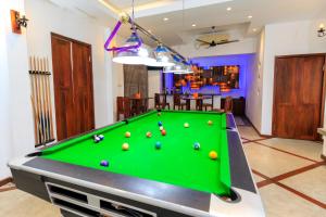 a pool table with balls on it in a room at Hikka Boutique in Hikkaduwa