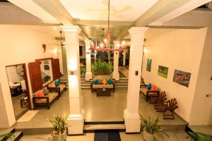 a lobby of a hotel with couches and chairs at Hikka Boutique in Hikkaduwa +114 photos