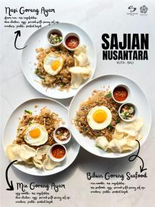 two plates of food with eggs on top at Sandat Hotel Legian in Legian