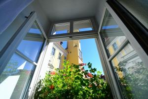 a window with a view of a building at Hotel Goldener Adler in Bautzen