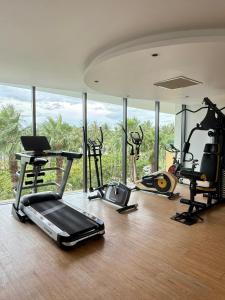a gym with several treadmills and exercise bikes at AHoa StarCity with Seaview in Nha Trang