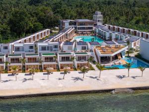 an aerial view of a resort on the beach at LIME Resort Bohol, a member of Radisson Individuals Premier in Panglao Island