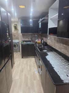 a kitchen with a sink and a counter top at luxury hotels home in Cairo