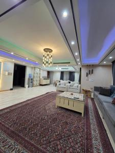 a large living room with a couch and a table at luxury hotels home in Cairo