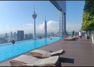 a swimming pool on the top of a building at Platinum Face suits in Kuala Lumpur