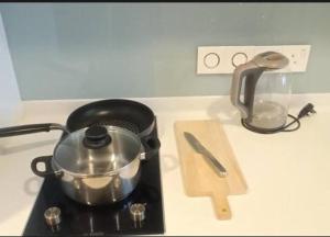 a pot sitting on top of a stove at Platinum Face suits in Kuala Lumpur