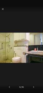 a bathroom with a toilet and a sink at Platinum Face suits in Kuala Lumpur +1 photo
