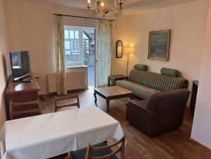 a living room with a couch and a table at Hugo zwei in Warburg
