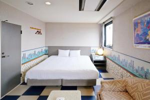a hotel room with a bed and a couch at ホテル韮崎インター in Nirasaki +121 photos