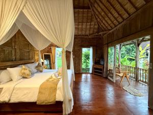 a bedroom with a bed in a room with windows at Sunshine dijoglo villa in Ubud +92 photos