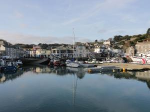 a body of water with boats in a harbor at Ripple in Bodmin