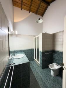 a bathroom with a sink and a toilet in it at Villa House in Miriswatta +19 photos