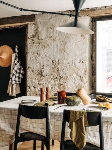 a dining room with a table with chairs and a white table cloth at The Barn Tasmania in Hobart +23 photos