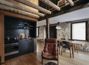 a kitchen and dining room with a table and chairs at The Barn Tasmania in Hobart
