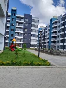 a playground in front of some apartment buildings at Staunch Homes Luxury Studio Apartment in Nairobi