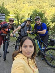 a group of people riding bikes on a trail at Riverside hostel in Ghanpokhara