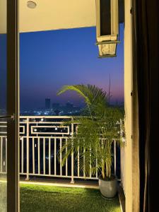a view of a balcony with a plant at Midnight Atelier in Greater Noida