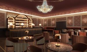 a restaurant with tables and chairs and a chandelier at Taj Hessischer Hof Frankfurt in Frankfurt