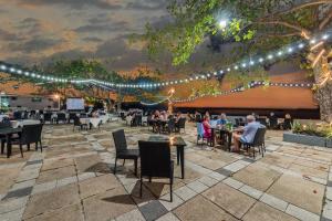 a patio with people sitting at tables and lights at Blue Bay Resort - Access to Pool and Beach-Phuket & Krabi in Ko Yao Yai +257 photos
