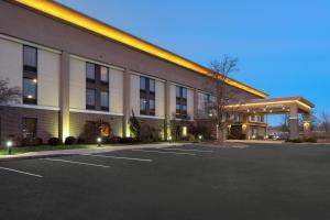 a large building with a parking lot in front of it at Hampton Inn Marietta in Marietta