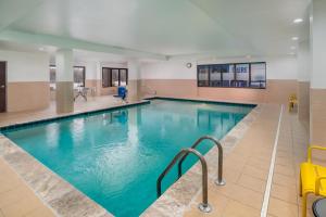 a large swimming pool with blue water at Hampton Inn Marietta in Marietta