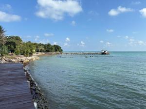 a train on a bridge over the water at Issara Beach Resort in Sichon