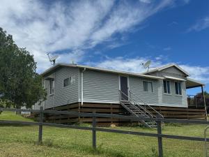 a house with satellites on the side of it at Wild Platypus Stays in Eungella