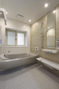 a large bathroom with a tub and a shower at KOGUMA AKIRUNO villa in Akiruno +34 photos